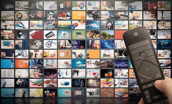 A remote pointing at image of television